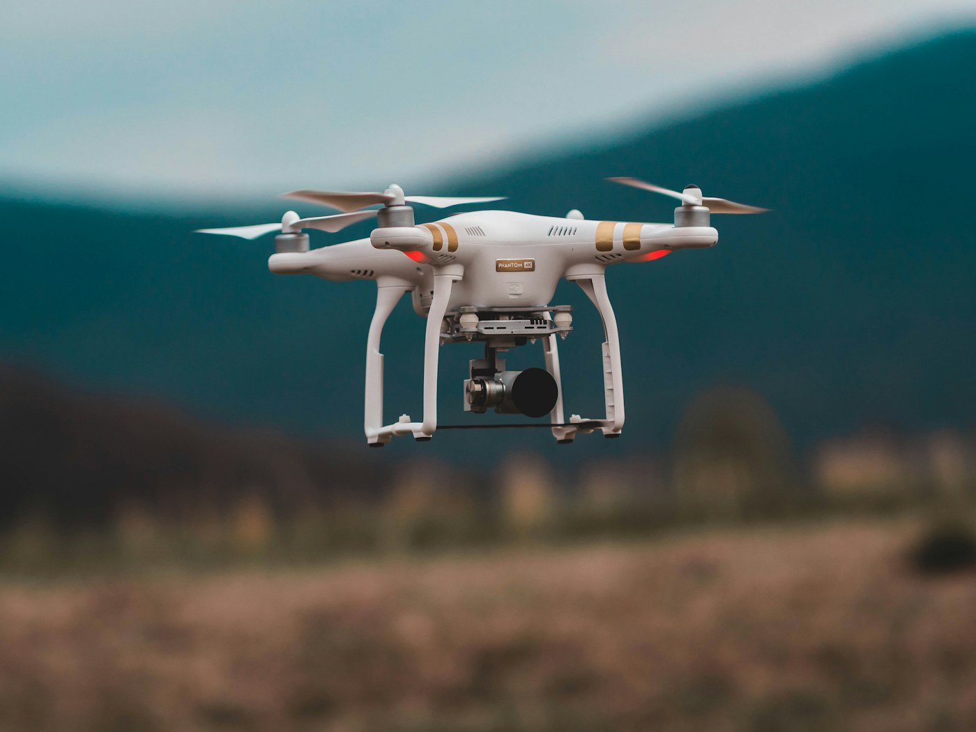 A drone flying against an evening sky